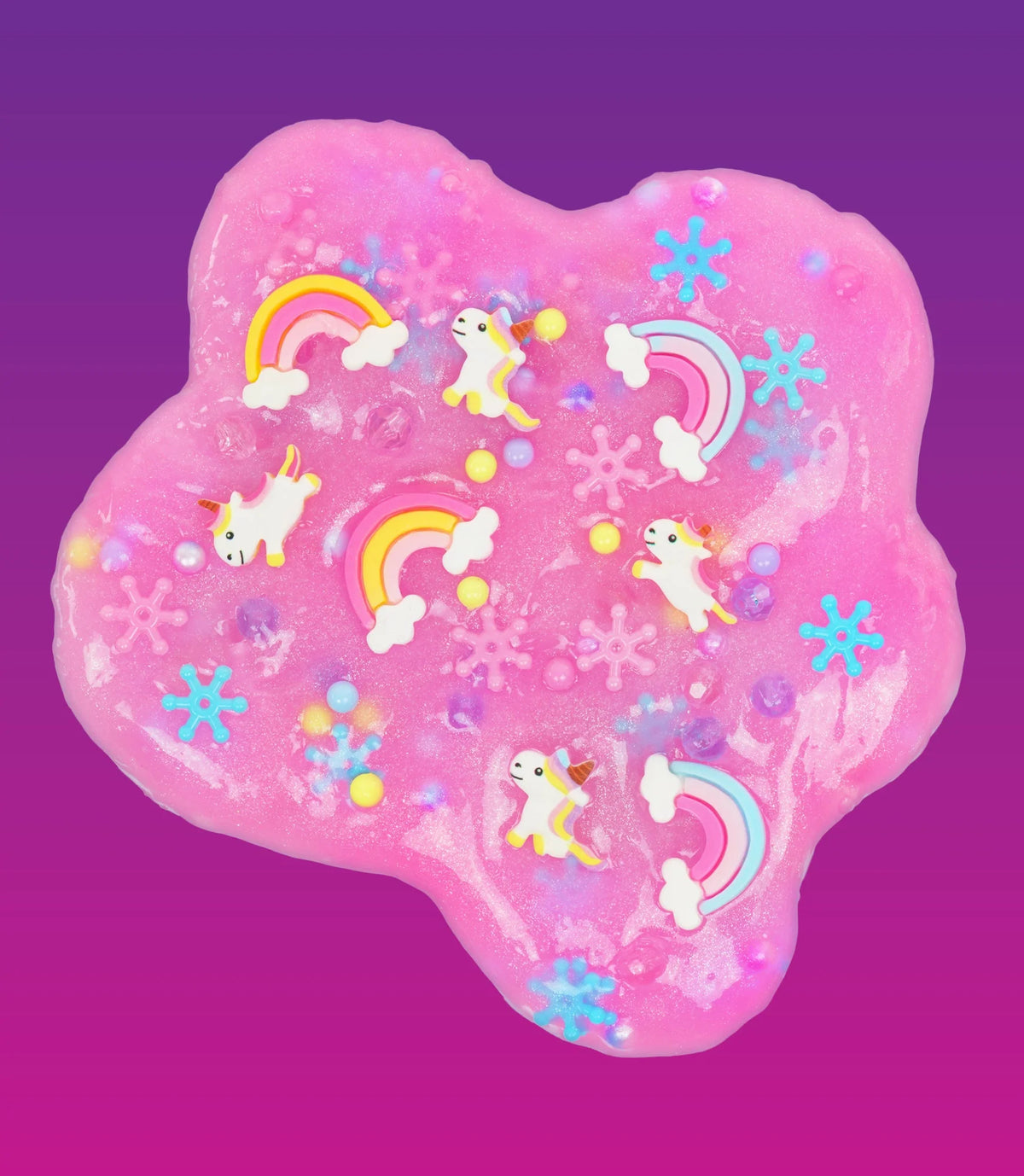 Uitgespreid roze Unicorn Dream-slijm met eenhoorns, regenbogen en gekleurde bolletjes op een paarse achtergrond.