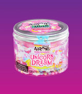Gesloten pot Crazy Aarons Slime Charmers Unicorn Dream met zilverkleurig deksel tegen een paarse achtergrond.