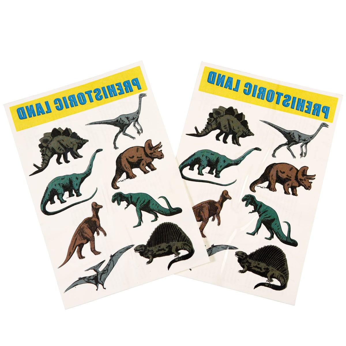 Twee vellen dino-plaktattoos met groene, bruine en grijze prehistorische dieren op een witte achtergrond