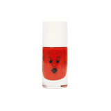 Oranje Tropical nagellak in een flesje met witte dop en een getekend gezichtje met wimpers en zwarte lippen.