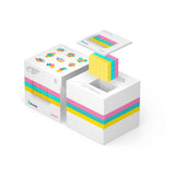 Geopende Pixio Sweet verpakking met magnetische blokjes in geel, turquoise en roze en een instructieboekje.