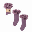Paarse tutu kniekousen van Mama's Feet met brede ruches aan de bovenkant, los en met verpakking.