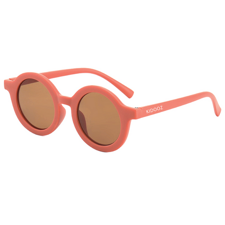 Kidooz Apricot kinderzonnebril met rond abrikooskleurig montuur en bruine glazen.